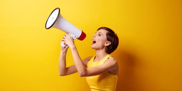 Female Model Using Bullhorn In Photo Session (5)