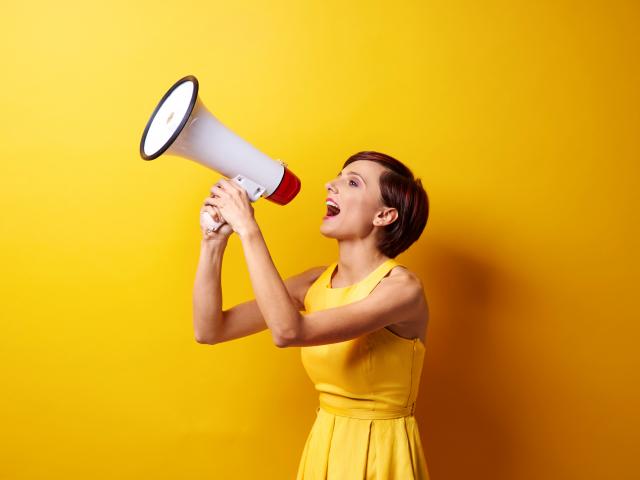 Female Model Using Bullhorn In Photo Session (5)